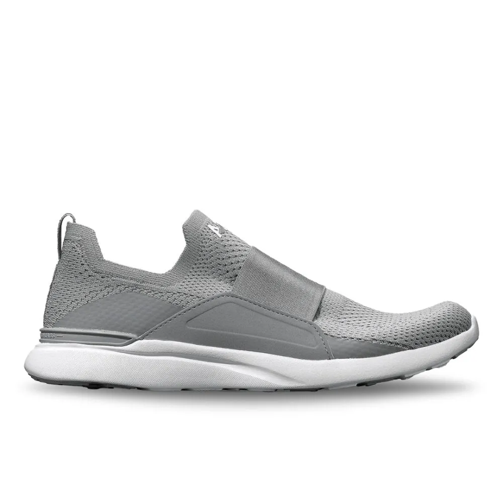 Optimize the title of this e-commerce product by requiring modifiers and translate it to English: APL Womens TechLoom Bliss Sneakers in Cement/White