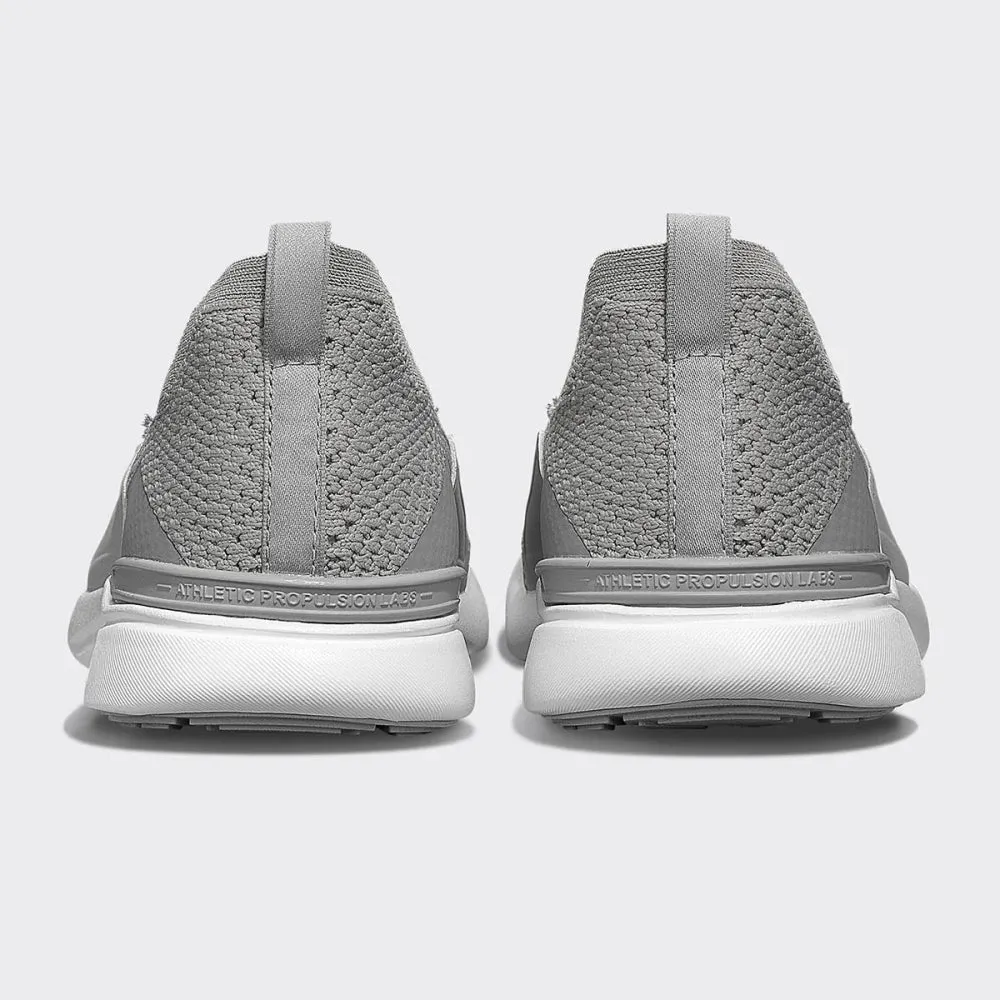 Optimize the title of this e-commerce product by requiring modifiers and translate it to English: APL Womens TechLoom Bliss Sneakers in Cement/White