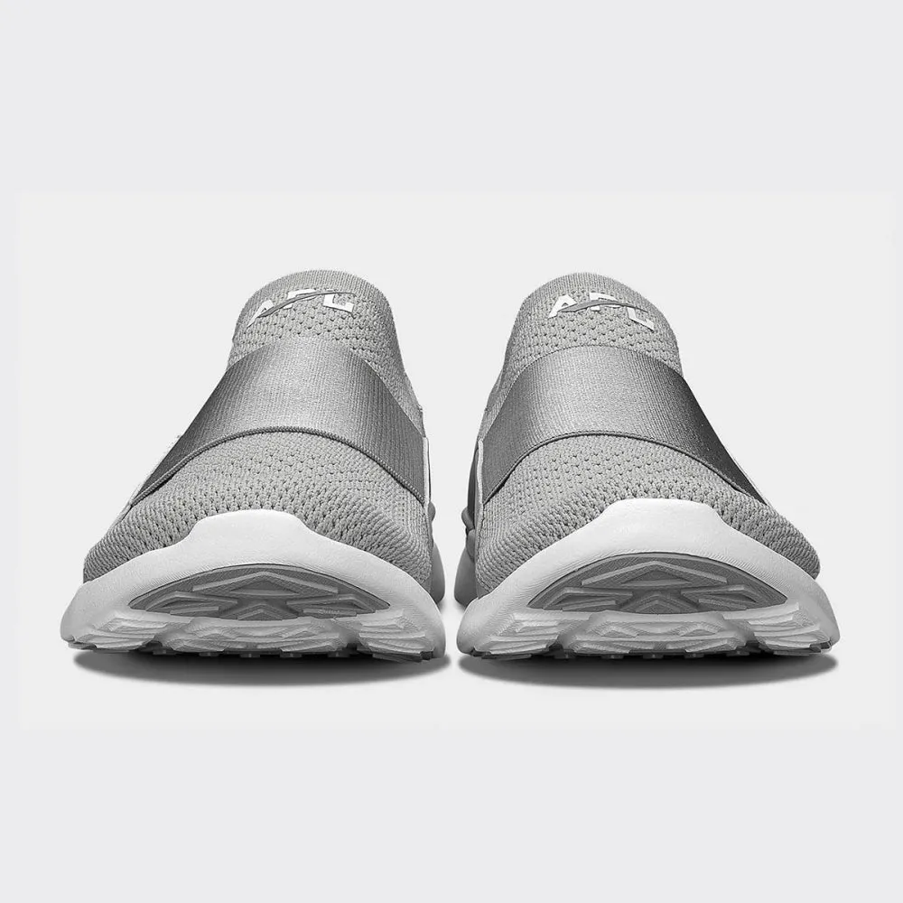 Optimize the title of this e-commerce product by requiring modifiers and translate it to English: APL Womens TechLoom Bliss Sneakers in Cement/White